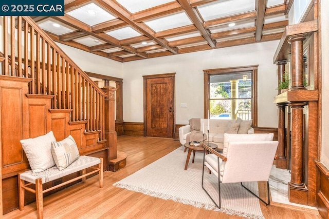 sitting room featuring beam ceiling, coffered ceiling, and light hardwood / wood-style flooring