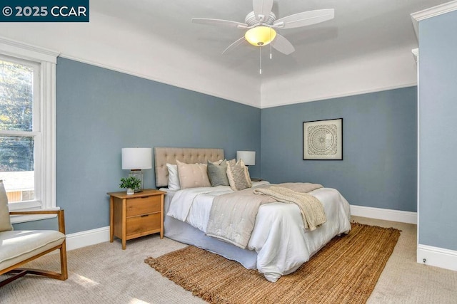 bedroom featuring light carpet and ceiling fan