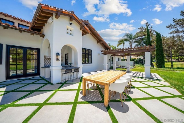 view of patio / terrace featuring french doors, a pergola, and an outdoor bar