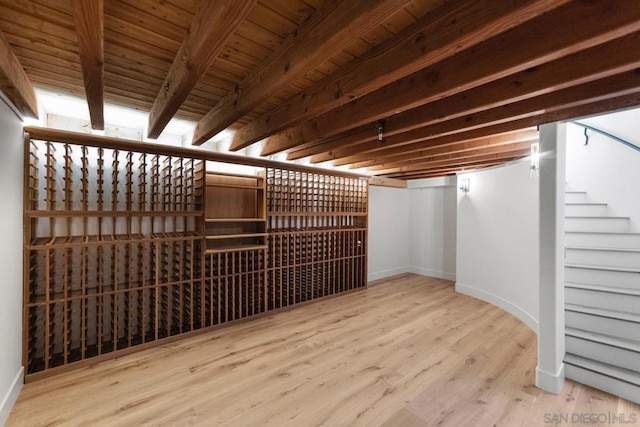 wine cellar with wood ceiling and hardwood / wood-style floors