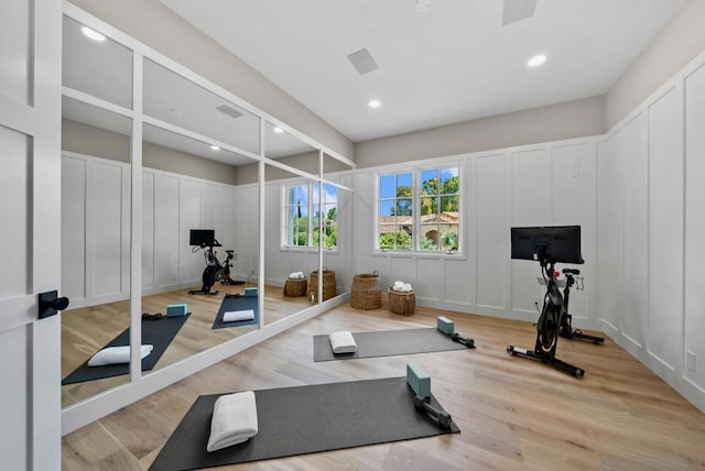 exercise area with light hardwood / wood-style floors