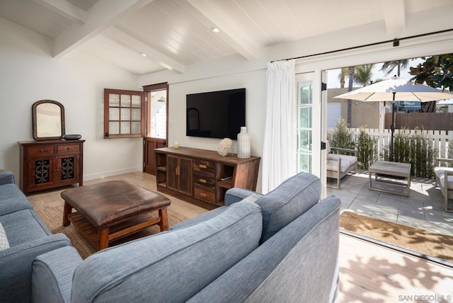 living room featuring beamed ceiling