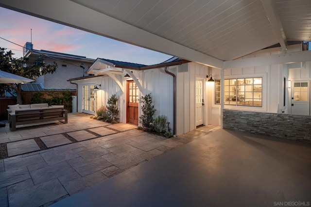 patio terrace at dusk with an outdoor hangout area