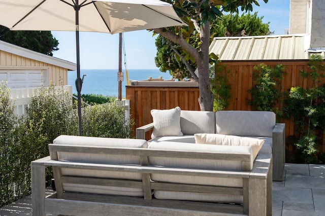 view of patio / terrace featuring an outdoor living space and a water view