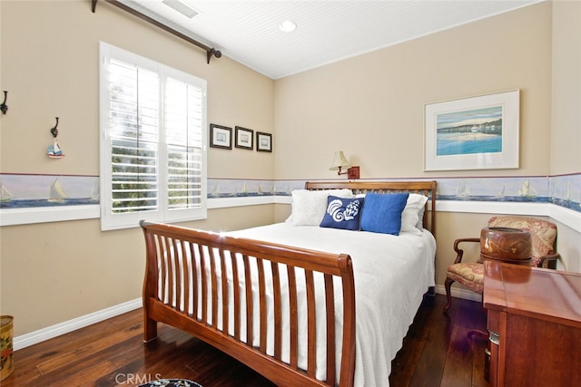 bedroom with dark wood-type flooring