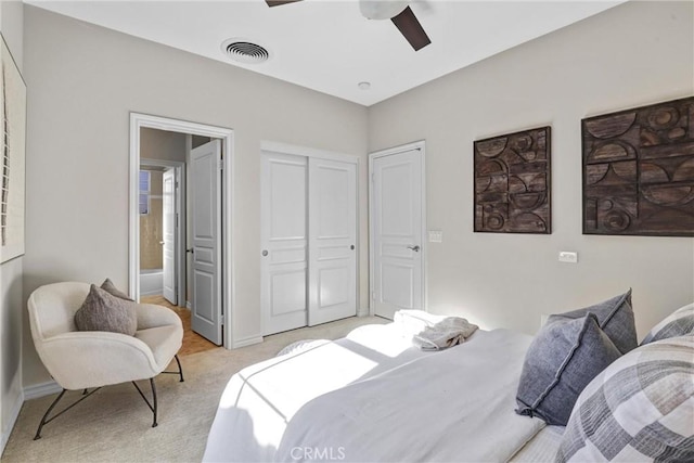 bedroom with light colored carpet and ceiling fan