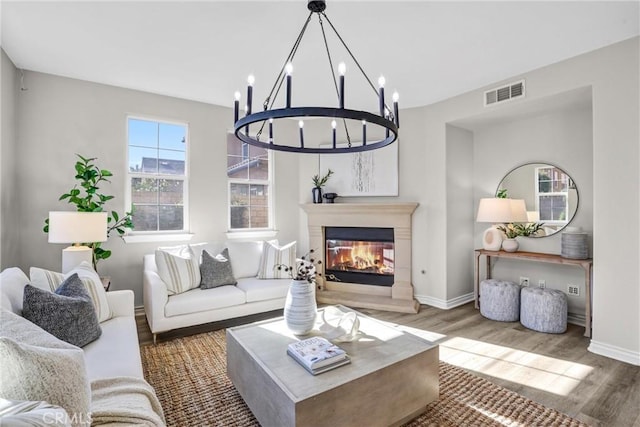 living room featuring a notable chandelier and hardwood / wood-style floors