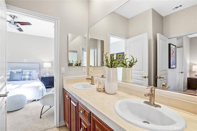 bathroom featuring vanity, tile patterned floors, and ceiling fan