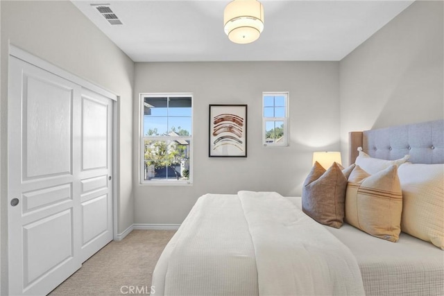 bedroom with light carpet