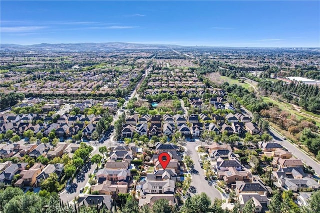 birds eye view of property featuring a mountain view