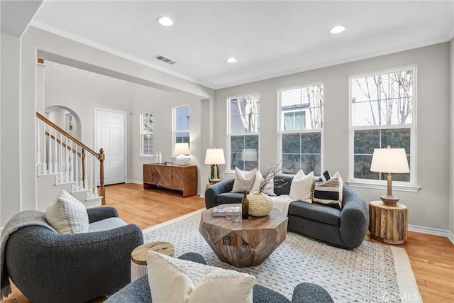 interior space with light hardwood / wood-style floors and crown molding