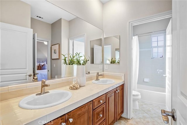 full bathroom featuring toilet, shower / bathtub combination with curtain, tile patterned floors, and vanity