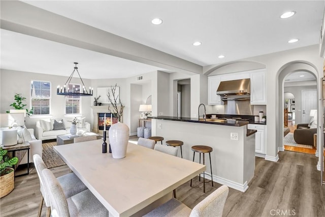 dining room featuring sink and hardwood / wood-style floors