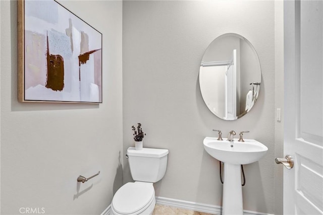 bathroom featuring sink and toilet