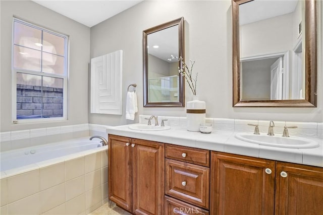 bathroom featuring shower with separate bathtub and vanity