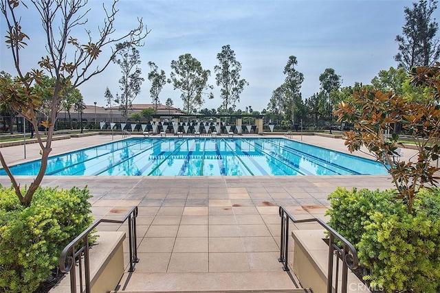 view of pool featuring a patio area