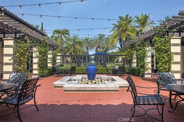 deck featuring a pergola and a patio area