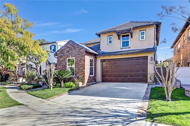 front facade featuring a front yard and a garage