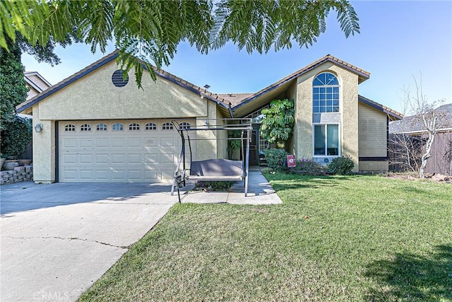 view of front of property with a front yard and a garage