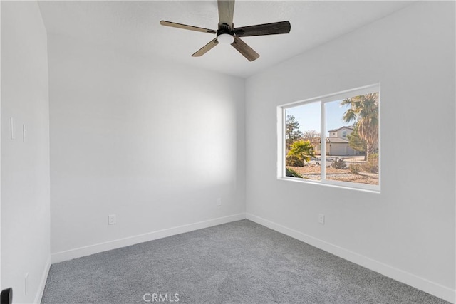 empty room with ceiling fan and carpet