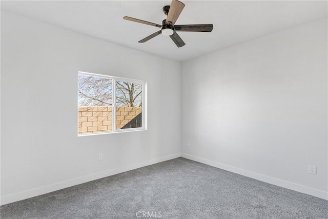 carpeted empty room with ceiling fan