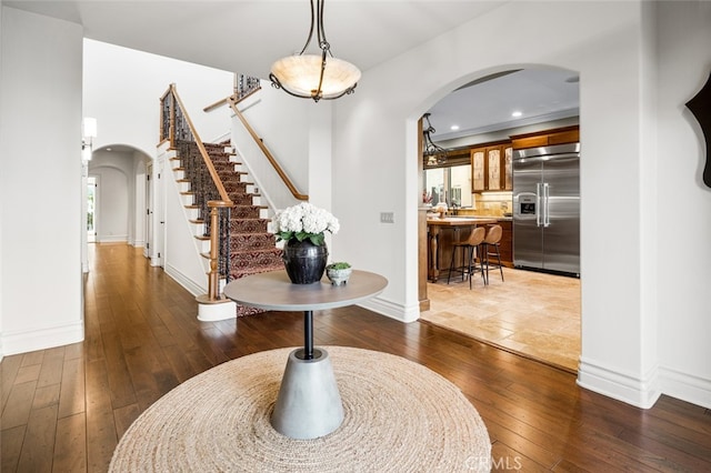 entrance foyer with dark hardwood / wood-style floors and sink