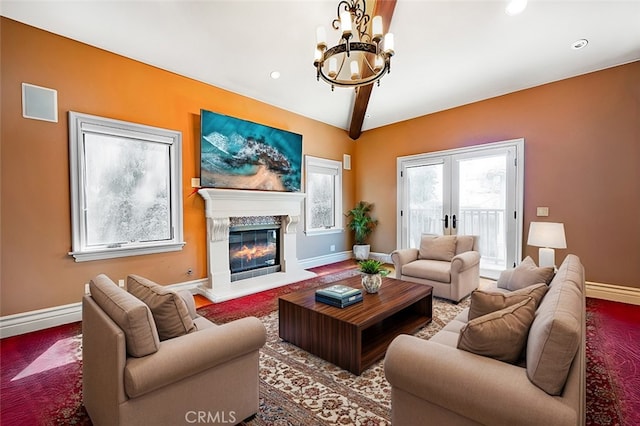 living room featuring a high end fireplace, french doors, lofted ceiling with beams, and a notable chandelier