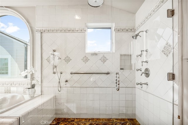 bathroom with tile patterned floors and separate shower and tub