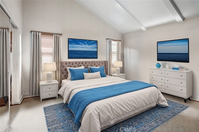 carpeted bedroom with lofted ceiling with beams