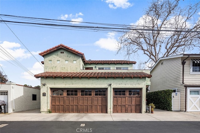 mediterranean / spanish house featuring a garage