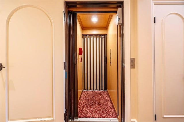 interior space featuring wooden ceiling and elevator