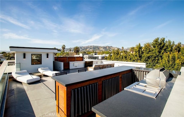 view of patio / terrace with a mountain view