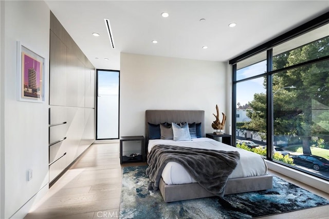 bedroom featuring light hardwood / wood-style flooring