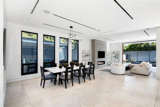 dining room featuring a large fireplace