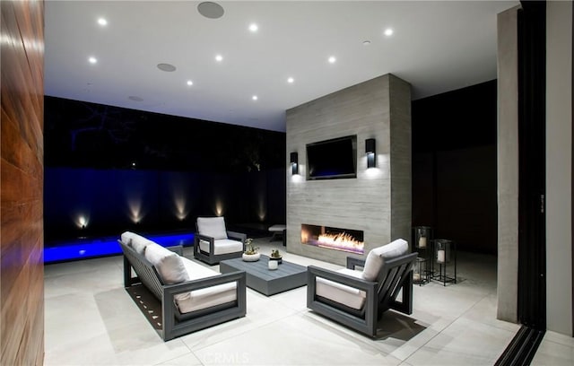 view of patio / terrace featuring an outdoor living space with a fireplace