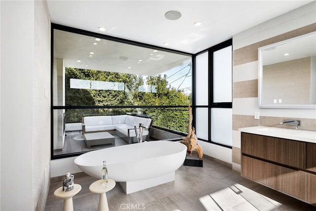 bathroom featuring vanity and a bathing tub