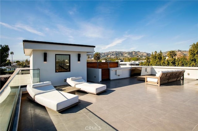 view of patio with a mountain view, outdoor lounge area, and area for grilling