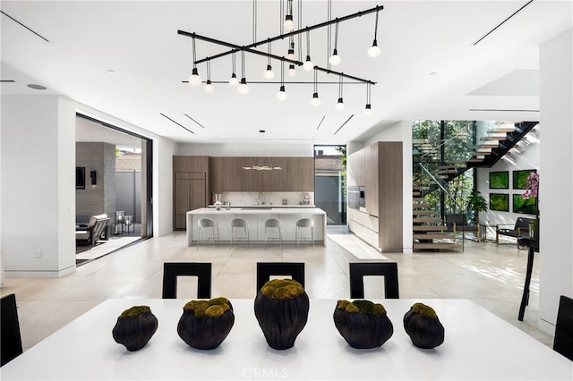 living room with a wall of windows and plenty of natural light