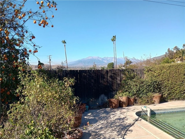 view of patio / terrace with a mountain view