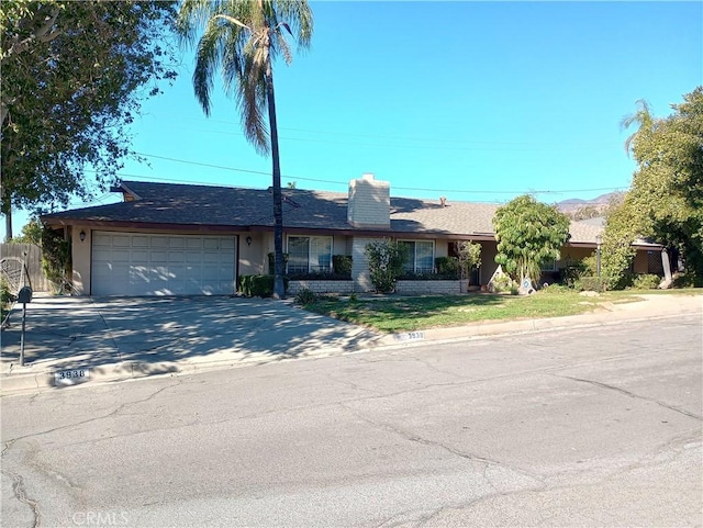 single story home with a garage