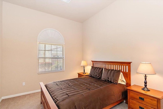 bedroom featuring light carpet