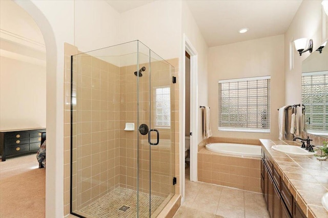 full bathroom featuring plus walk in shower, toilet, tile patterned floors, and vanity