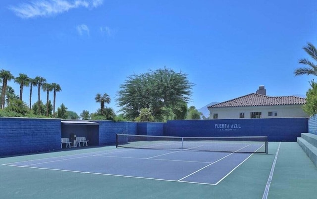 view of tennis court featuring basketball court