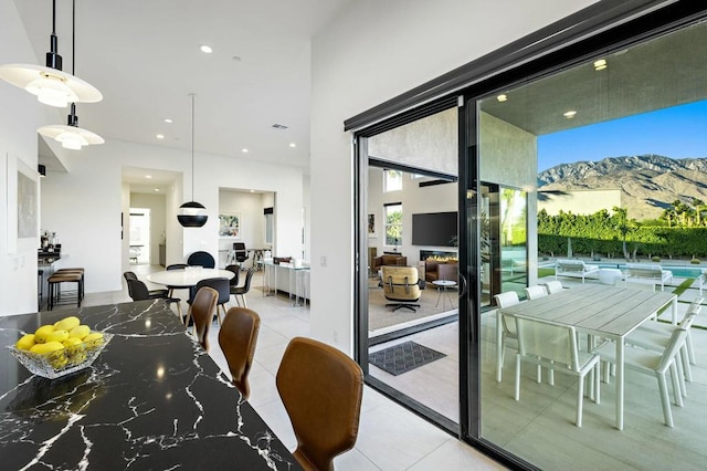 dining space featuring a wealth of natural light and light tile patterned floors