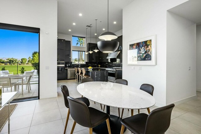 dining space featuring light tile patterned floors