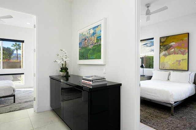 bedroom featuring ceiling fan and light tile patterned floors