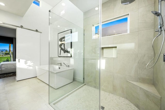 bathroom with shower with separate bathtub and tile patterned flooring