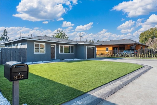 ranch-style home featuring a garage and a front lawn