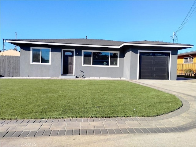 single story home with a garage and a front lawn