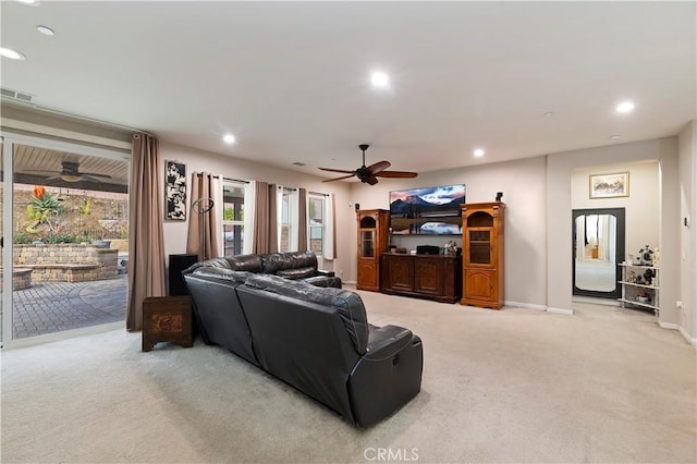 carpeted living area featuring a ceiling fan, recessed lighting, visible vents, and baseboards